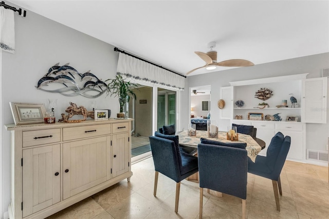 dining area with visible vents and a ceiling fan