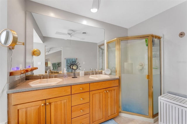 full bath featuring a shower stall, radiator, and a sink