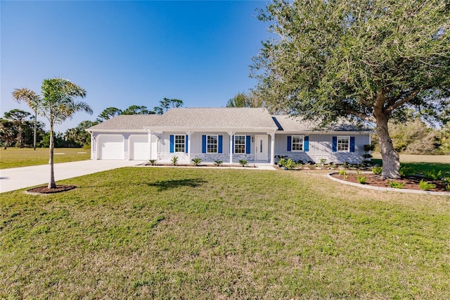 ranch-style home featuring a front lawn, a garage, and covered porch