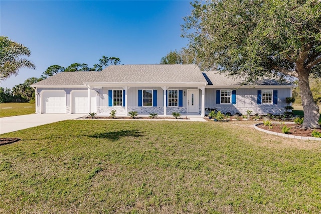 ranch-style home featuring a front lawn, covered porch, and a garage