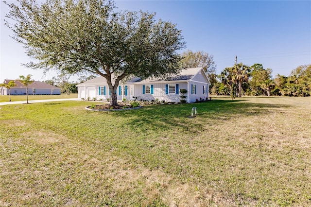 exterior space with a front lawn and a garage