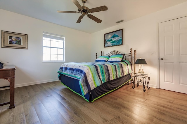 bedroom featuring ceiling fan and hardwood / wood-style flooring