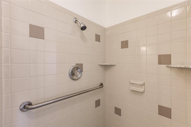 bathroom with tiled shower