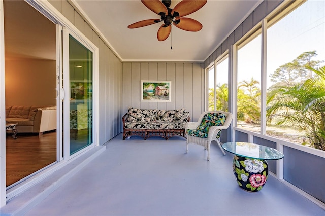 sunroom featuring ceiling fan