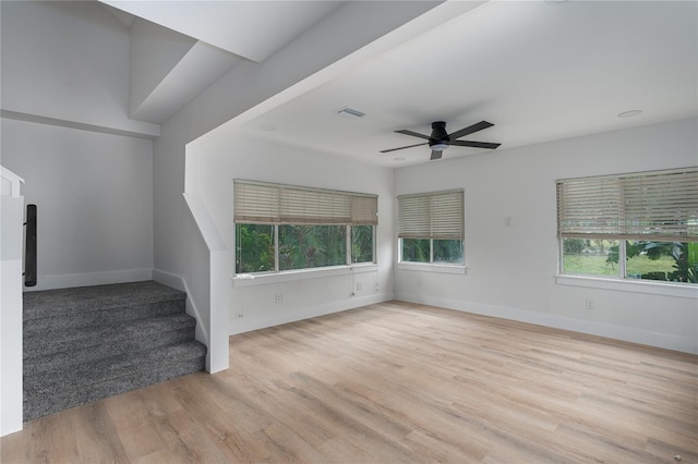 spare room featuring ceiling fan and light wood-type flooring