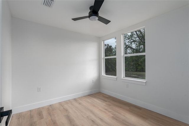 spare room featuring ceiling fan and light wood-type flooring