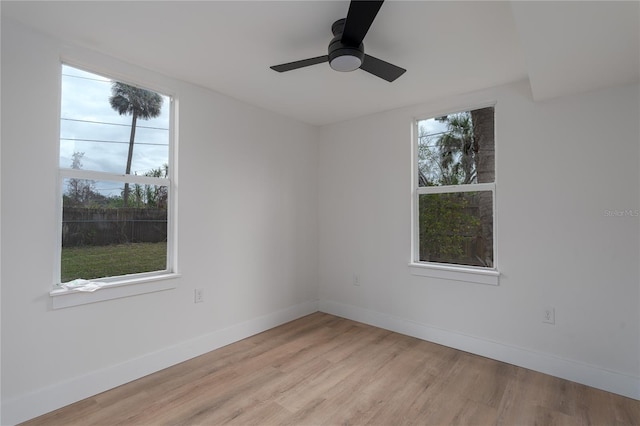 unfurnished room featuring ceiling fan and light hardwood / wood-style floors