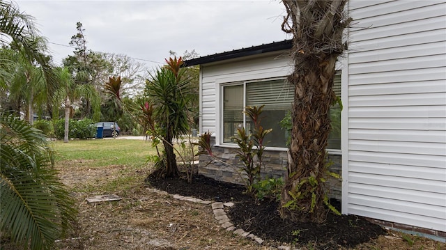 view of home's exterior with a yard