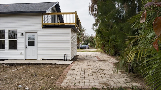 view of home's exterior featuring a balcony