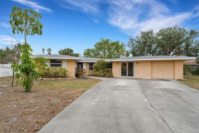 ranch-style house featuring a garage