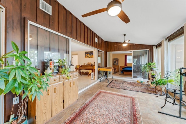 interior space featuring vaulted ceiling and ceiling fan