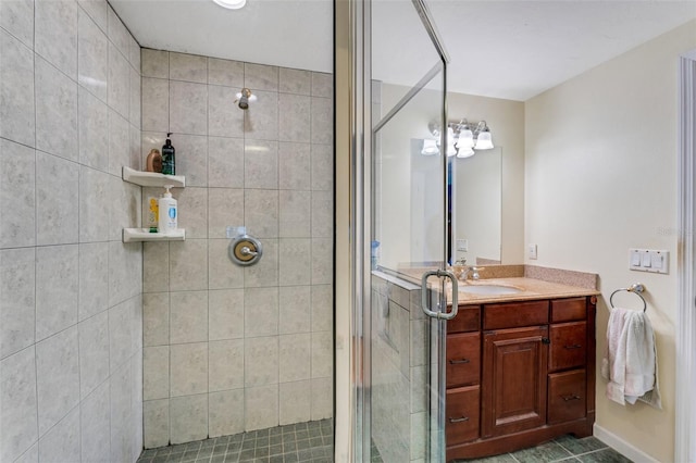 bathroom featuring vanity and a shower with shower door