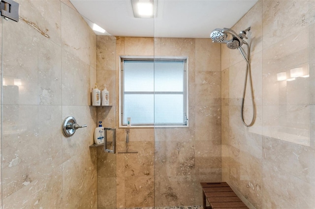 bathroom featuring tiled shower