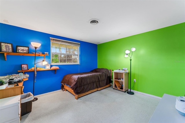 bedroom with light colored carpet