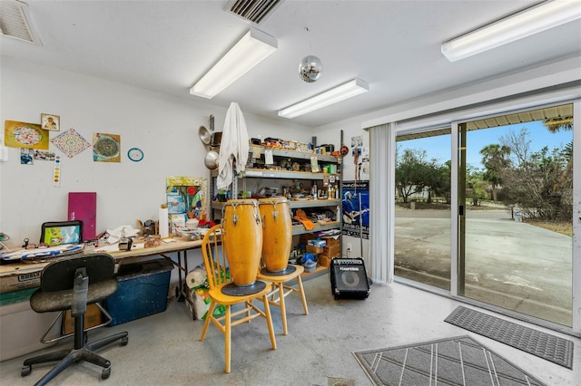 office area featuring a workshop area and concrete floors