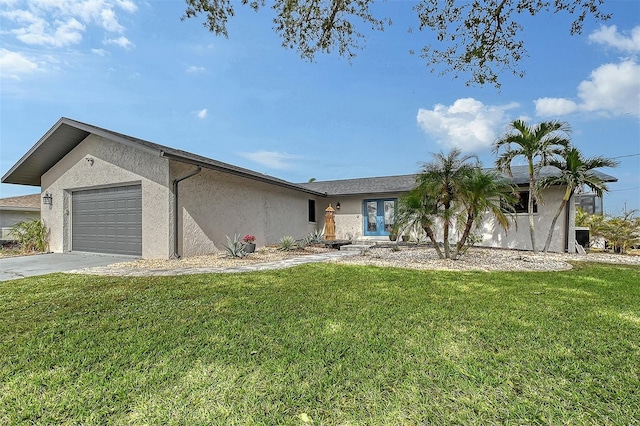 ranch-style home with a garage and a front yard