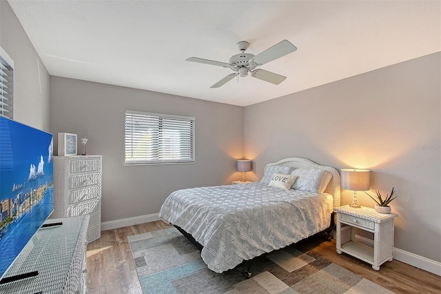 bedroom featuring ceiling fan and hardwood / wood-style flooring