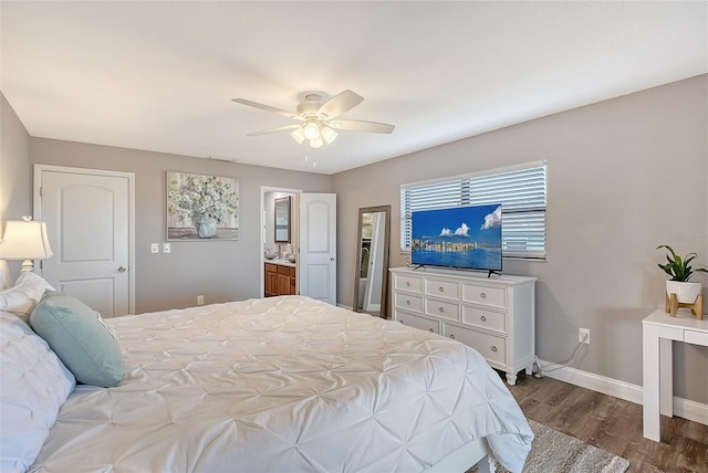 bedroom featuring ceiling fan, wood-type flooring, and connected bathroom