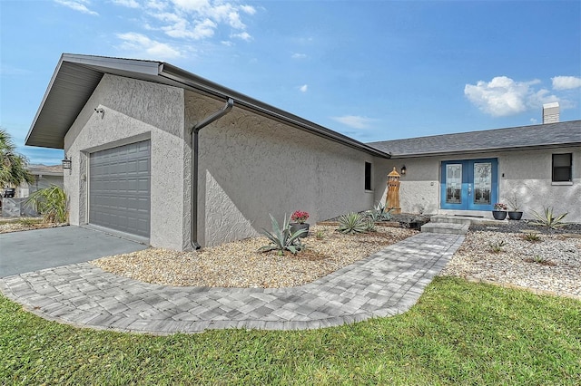 view of front of house featuring french doors and a garage