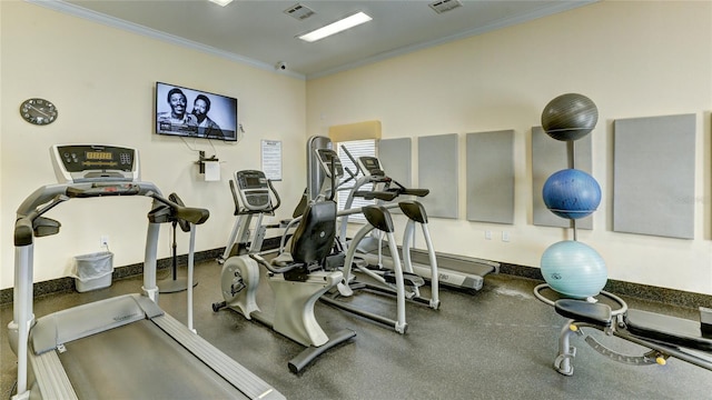 exercise room featuring ornamental molding