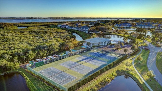 aerial view at dusk with a water view