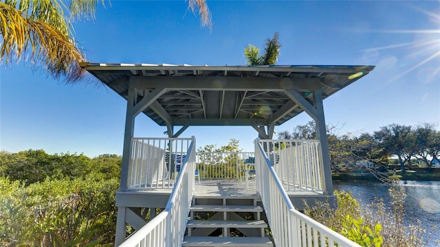 exterior space with a deck with water view