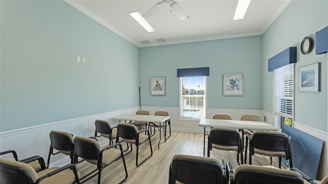 interior space with crown molding, ceiling fan, and light hardwood / wood-style floors