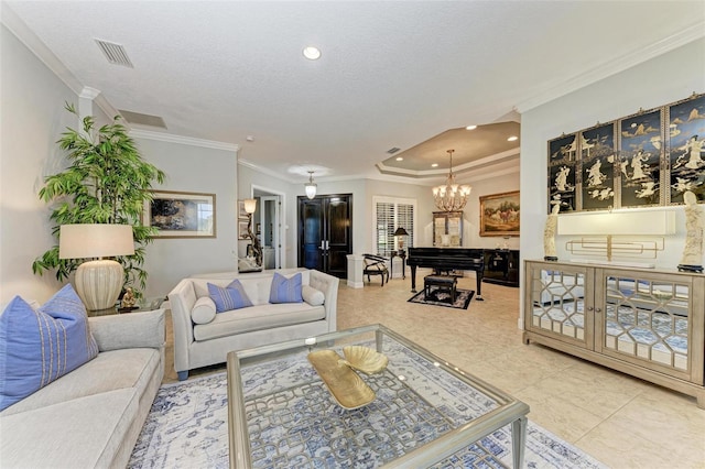 tiled living room with a raised ceiling, ornamental molding, a notable chandelier, and a textured ceiling