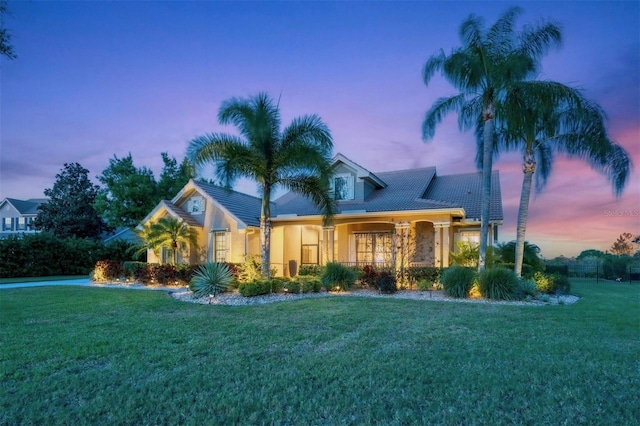 view of front of home with a lawn