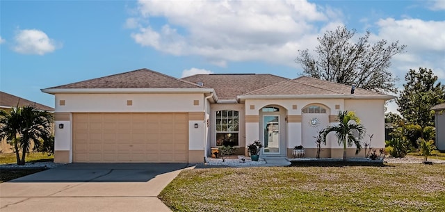 view of front of house with a garage and a front lawn