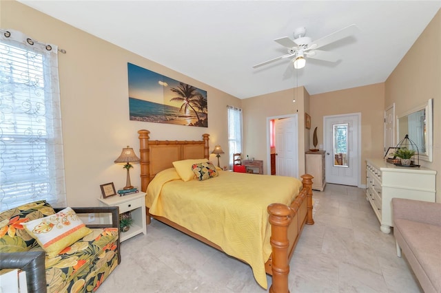 bedroom with multiple windows and ceiling fan