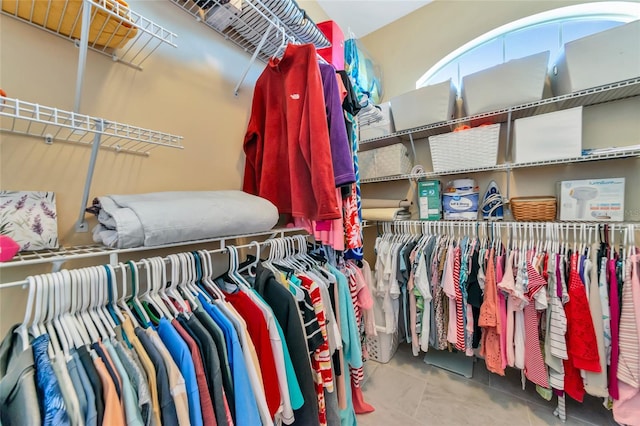 spacious closet featuring tile patterned floors