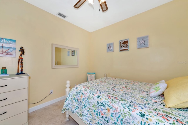 tiled bedroom with ceiling fan