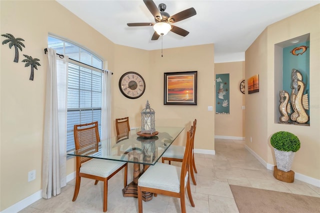 tiled dining room with ceiling fan