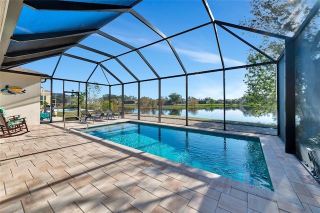 view of swimming pool featuring a water view, glass enclosure, and a patio area