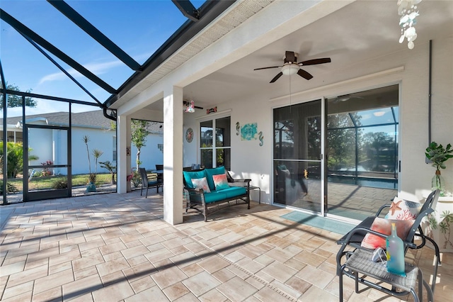 view of patio / terrace with glass enclosure and ceiling fan