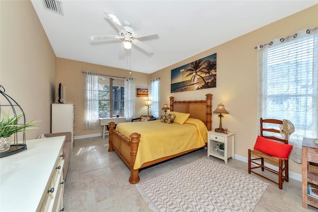 bedroom featuring ceiling fan and light tile patterned flooring