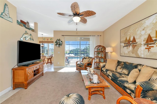 living room with light carpet and ceiling fan