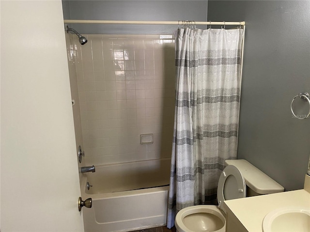 full bathroom with vanity, shower / tub combo with curtain, and toilet