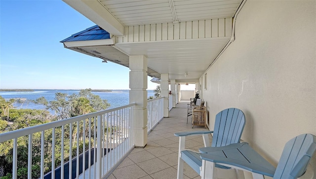 balcony featuring a water view