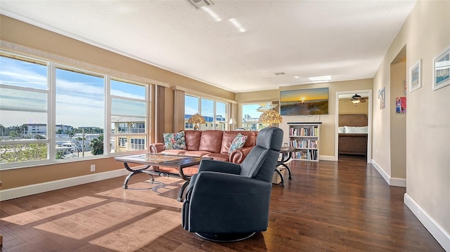 living room featuring ceiling fan and dark wood-type flooring