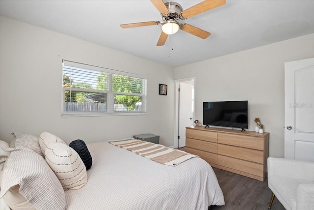 bedroom featuring ceiling fan and dark wood-type flooring