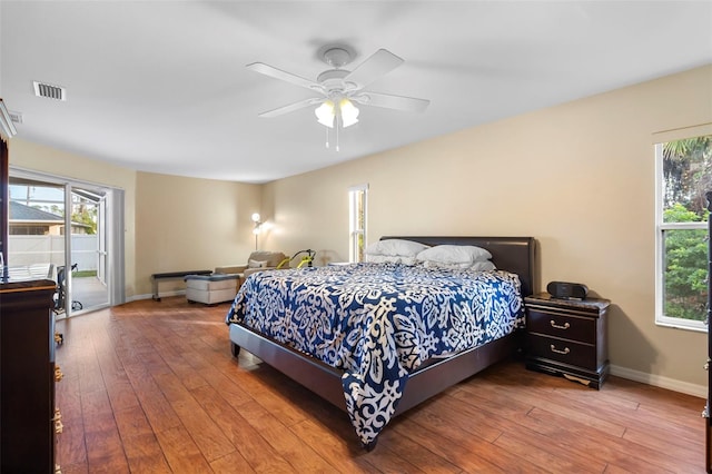 bedroom featuring ceiling fan, access to exterior, and light hardwood / wood-style floors