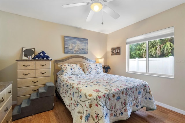 bedroom featuring hardwood / wood-style floors and ceiling fan