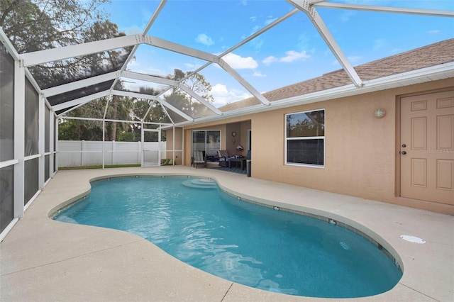 view of pool featuring a lanai and a patio area