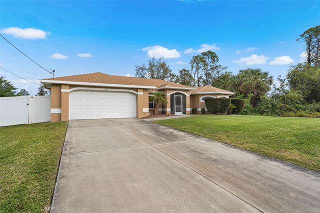 view of front of home featuring a garage and a front lawn