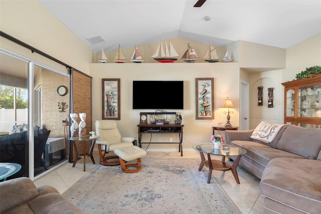 living area with light tile patterned floors, ceiling fan, visible vents, and vaulted ceiling