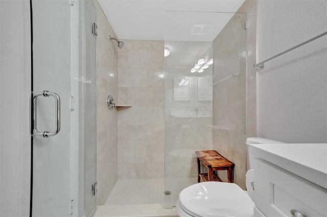 bathroom featuring toilet and walk in shower