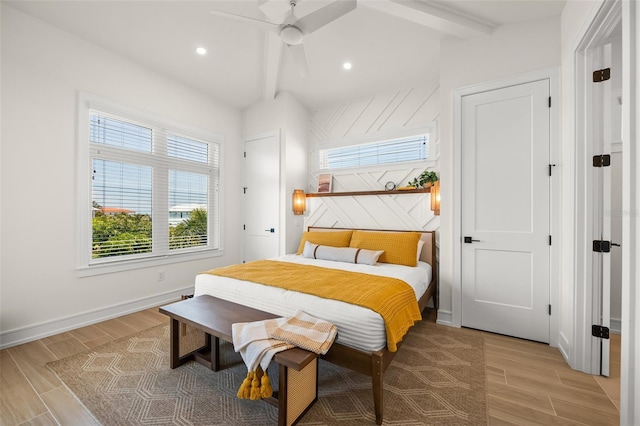 bedroom featuring ceiling fan and beamed ceiling