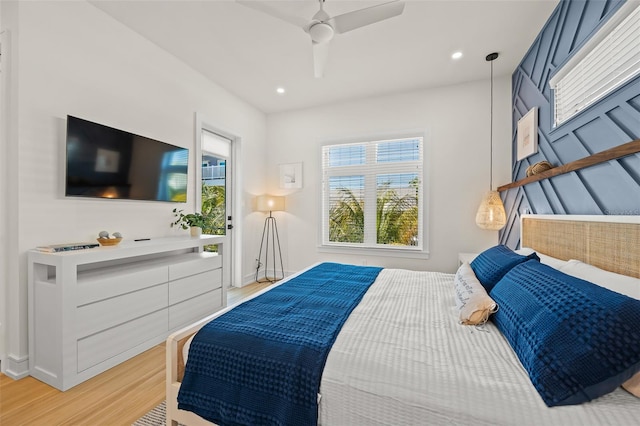 bedroom with ceiling fan and hardwood / wood-style floors